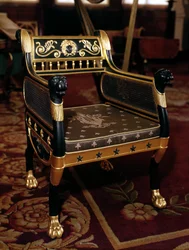 Carved armchair with gilt details